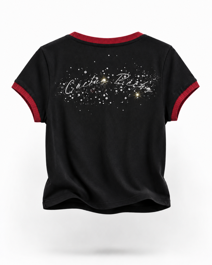 Black t-shirt with red trim featuring a decorative text design on a white background