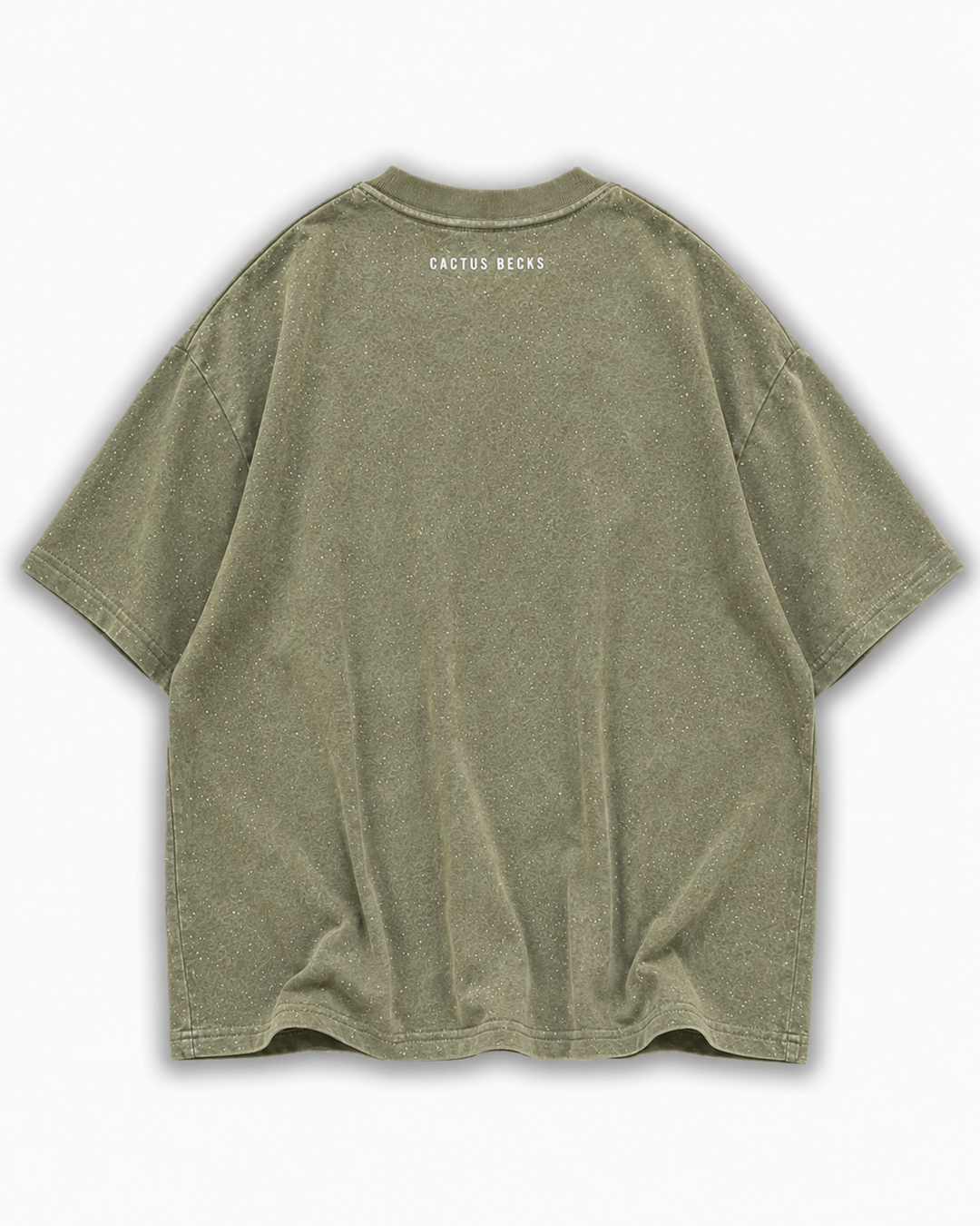 Green t-shirt with glitter dots and a small Cactus Becks logo on a white background