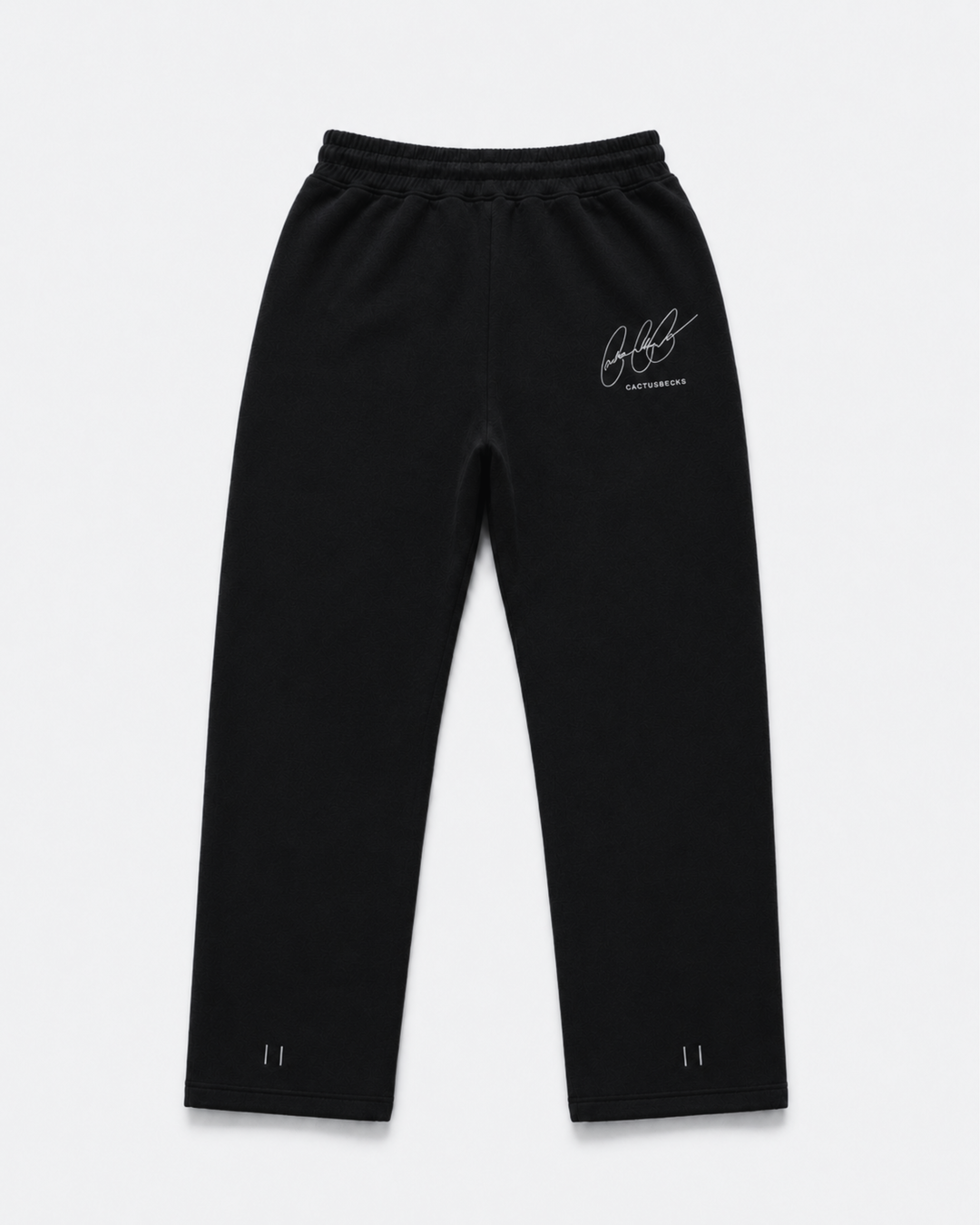 Black track pants with Cactus Becks embroidery on the back