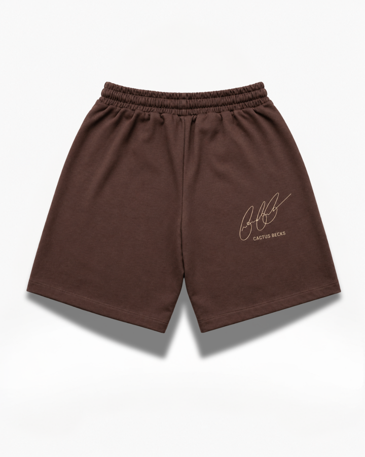 Brown Cactus Becks shorts with the Cactus Becks signature logo on a white background