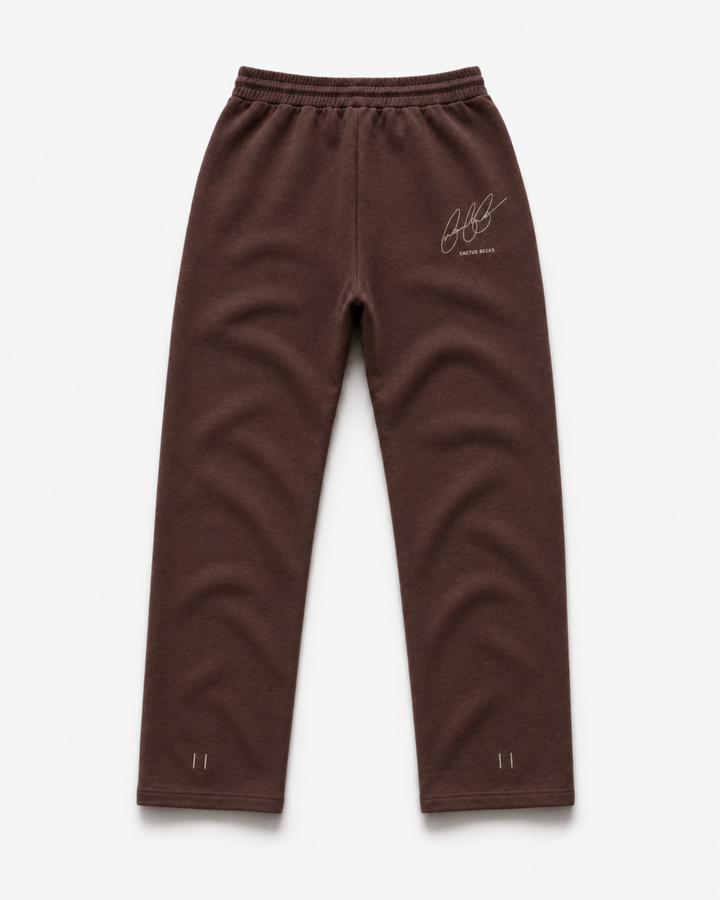 Brown track pants with Cactus Becks embroidery on the back and the 11/11 angel numbers.