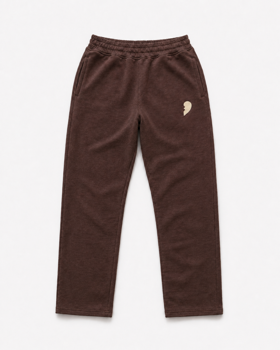 Brown track pants by Cactus Becks with a broken heart on the front