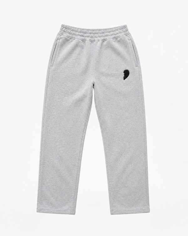 Gray track pants by cactus becks with a broken heart on the front