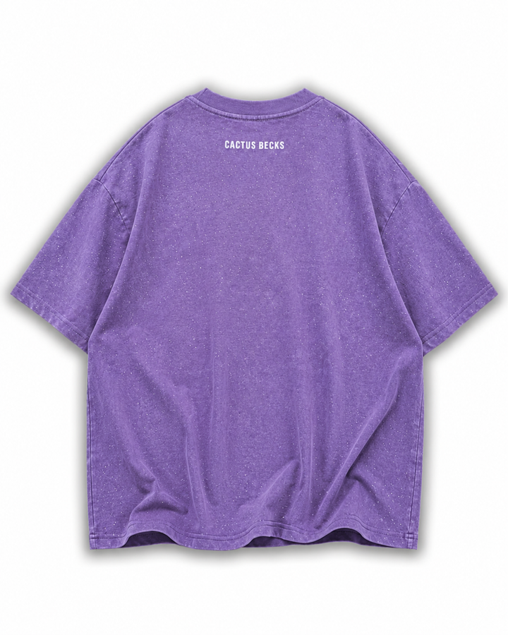 Purple t-shirt with glitter dots and a small Cactus Becks logo on a white background