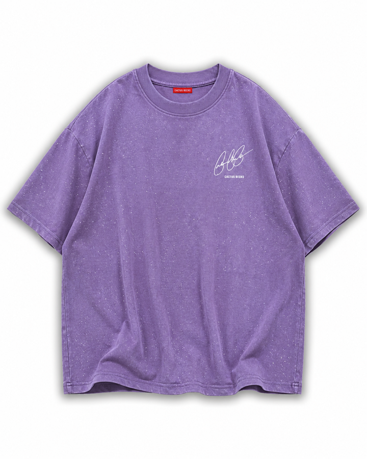Purple t-shirt with glitter dots and a small Cactus Becks logo on a white background