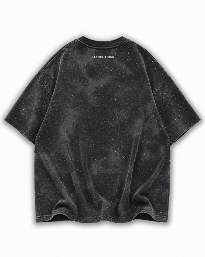 Black t-shirt with glitter dots and a small Cactus Becks logo on a white background